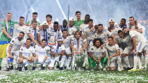 Real Madrid players line-up for a team photograph during celebrations at estadio Santiago Bernabeu after winning the UEFA Champions League Final on May 29, 2022.