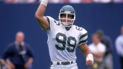 Defensive end Mark Gastineau #99 of the New York Jets celebrates on the field during a game circa September of 1988.
