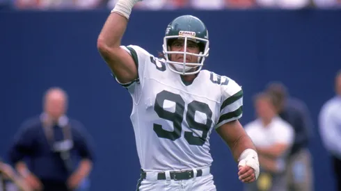 Defensive end Mark Gastineau #99 of the New York Jets celebrates on the field during a game circa September of 1988.