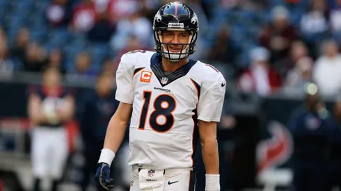 Peyton Manning #18 of the Denver Broncos celebrates after throwing his fourth touchdown during the game against the Houston Texans at Reliant Stadium on December 22, 2013.