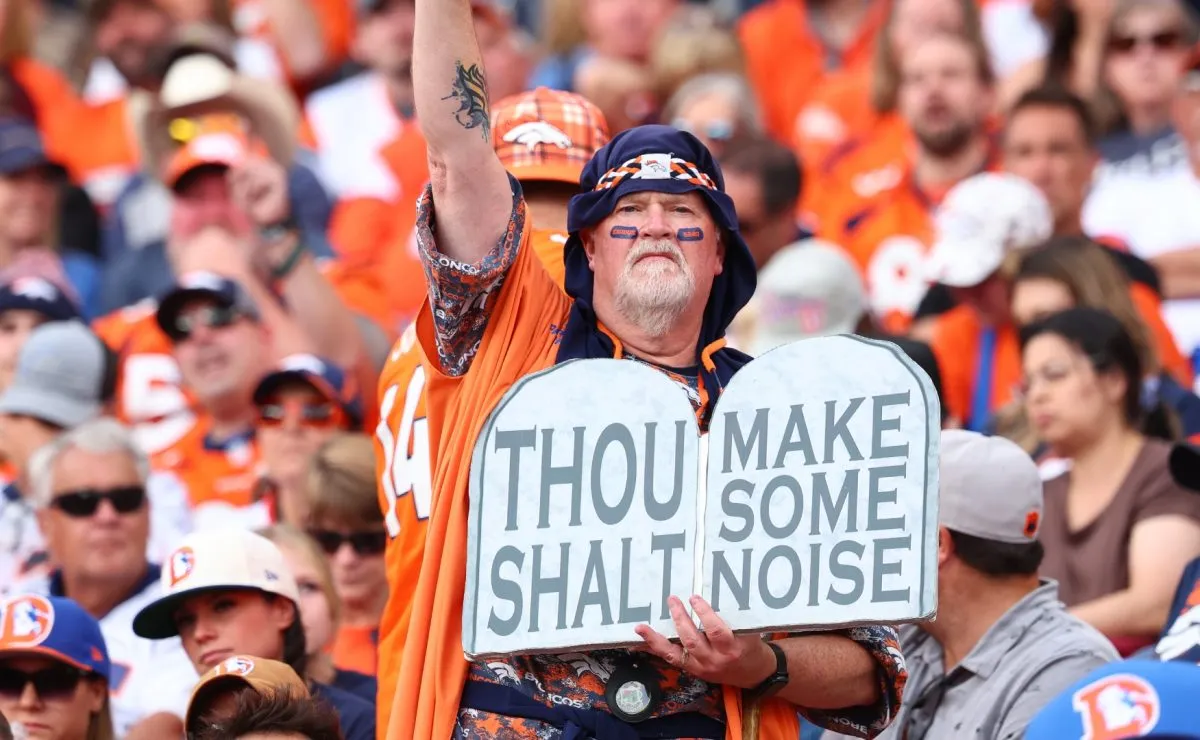 A Denver Broncos fan cheers during the fourth quarter against the Carolina Panthers in 2024. (Source: C. Morgan Engel/Getty Images)