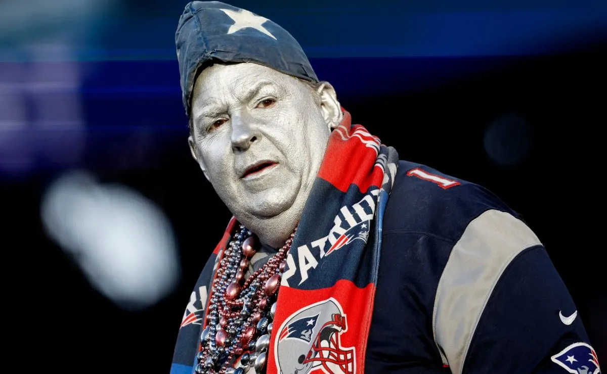 A New England Patriots fan watches his team against the Cincinnati Bengals in 2022. (Source: Winslow Townson/Getty Images)