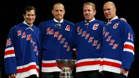 Adam Graves poses with former New York Rangers players Mike Richter, Brian Leetch and Mark Messier after Graves' jersey was raised to the rafters of the Madison Square Garden arena during a ceremony prior to a game in 2008.