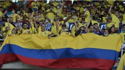 Fans of Colombia hold a flag