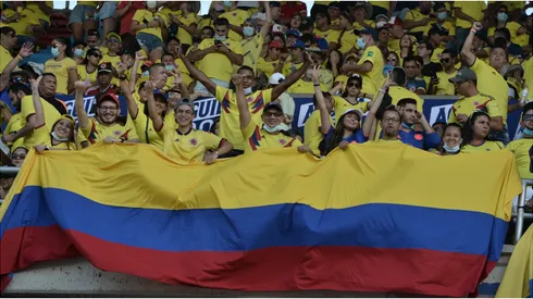 Fans of Colombia hold a flag