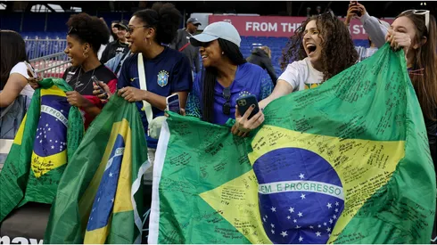 Fans hold Brazil flags
