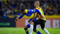 Sebastian Villa of Boca Juniors competes for the ball with Juan Pablo Zuluaga of Deportivo Pereira