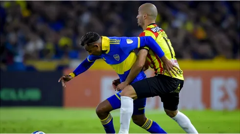 Sebastian Villa of Boca Juniors competes for the ball with Juan Pablo Zuluaga of Deportivo Pereira