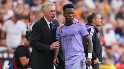 Carlo Ancelotti, Head Coach of Real Madrid, interacts with Vinicius Junior of Real Madrid