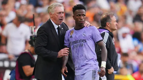 Carlo Ancelotti, Head Coach of Real Madrid, interacts with Vinicius Junior of Real Madrid