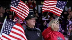 Fans wave American flags as they celebrate