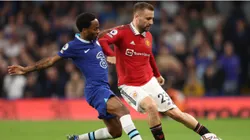 Luke Shaw of Manchester United battles for possession with Raheem Sterling of Chelsea