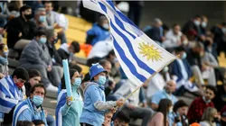 A fan of Uruguay waves a flag