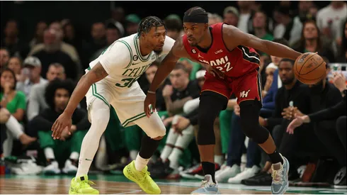 Jimmy Butler #22 of the Miami Heat is guarded by Marcus Smart #36 of the Boston Celtics