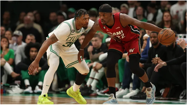 Jimmy Butler #22 of the Miami Heat is guarded by Marcus Smart #36 of the Boston Celtics
