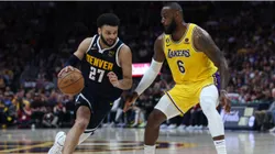 Jamal Murray #27 of the Denver Nuggets drives against LeBron James #6 of the Los Angeles Lakers