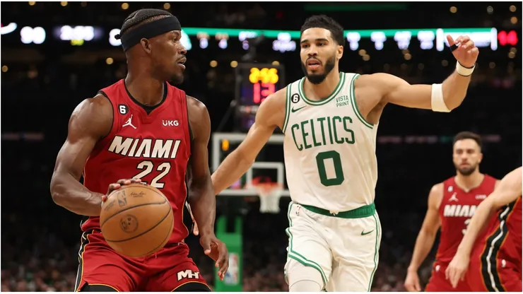 Jimmy Butler #22 of the Miami Heat is defended by Jayson Tatum #0 of the Boston Celtics