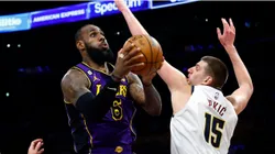 LeBron James #6 of the Los Angeles Lakers takes a shot against Nikola Jokic #15 of the Denver Nuggets