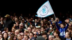 Chelsea fans wave flags in support of their team during the UEFA Women's Champions League semifinal 1st leg match between Chelsea FC and FC Barcelona at Stamford Bridge on April 22, 2023 in London, England.