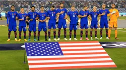 The United States team stands during the national anthem