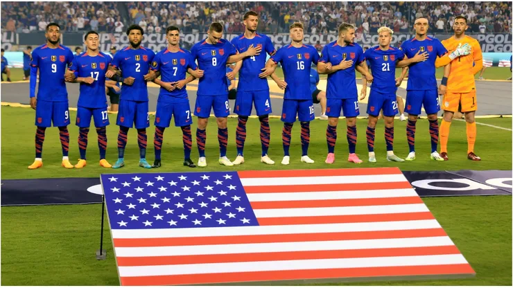The United States team stands during the national anthem