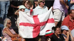Fans hold a large English flag
