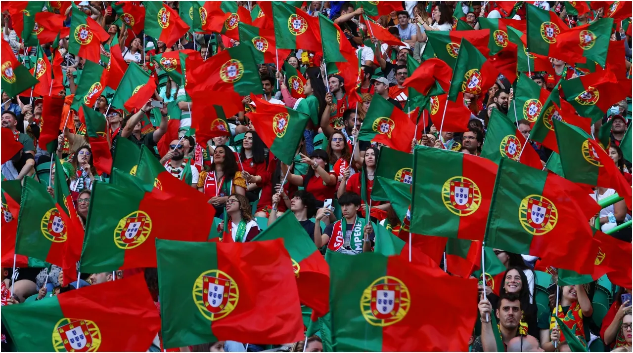 Portugal fans wave flags – Carlos Rodrigues/Getty Images