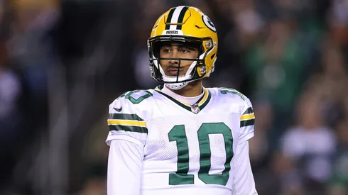 Jordan Love looks on during a game.