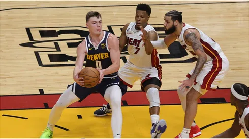 Christian Braun #0 of the Denver Nuggets drives the lane against Kyle Lowry #7 of the Miami Heat