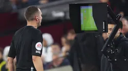 Premier League referee checks the VAR monitor