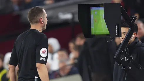 Premier League referee checks the VAR monitor