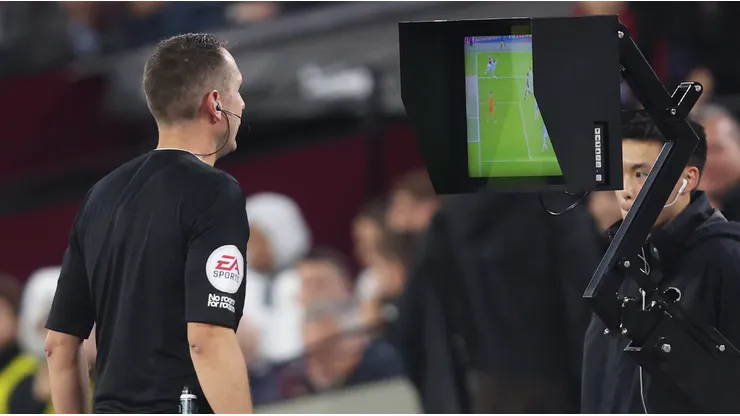 Premier League referee checks the VAR monitor