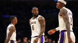 LeBron James #6, Lonnie Walker IV #4 and Jarred Vanderbilt #2 of the Los Angeles Lakers leave the court.
