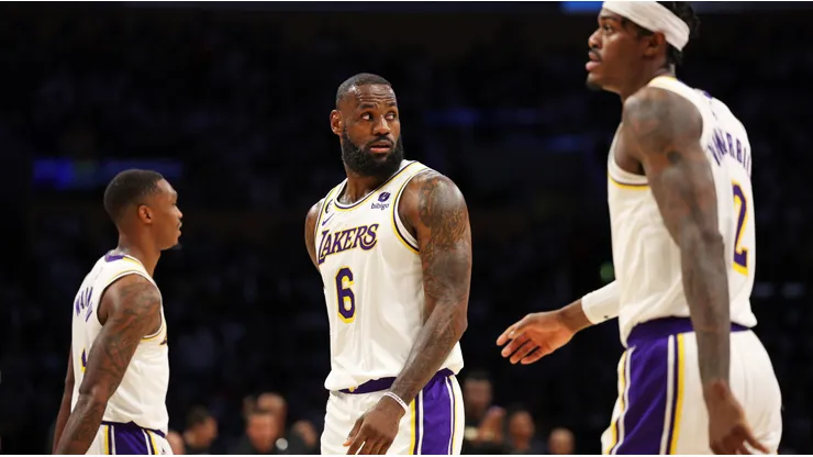 LeBron James #6, Lonnie Walker IV #4 and Jarred Vanderbilt #2 of the Los Angeles Lakers leave the court.