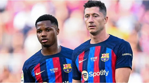Ansu Fati and Robert Lewandowski of FC Barcelona