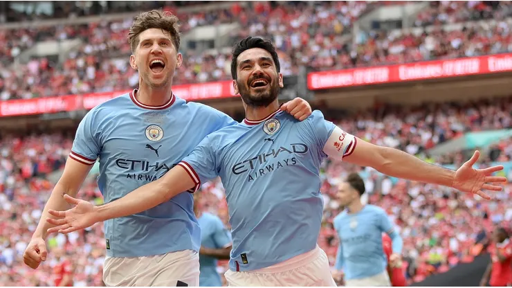 Ilkay Gundogan of Manchester City celebrates with teammate John Stones after scoring the team's second goal during the 2023 FA Cup Final