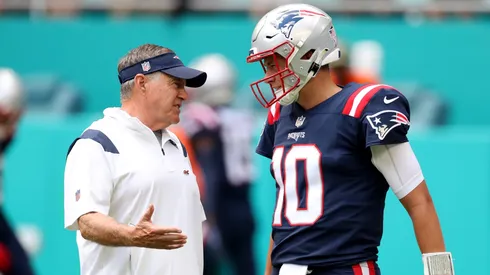 Bill Belichick (left) and Mac Jones