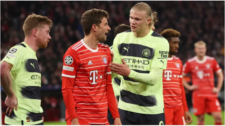 Erling Haaland of Manchester City reacts towards Thomas Mueller of FC Bayern Munich