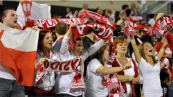 Polish fans cheer on their team