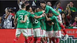 Teammates celebrate with Henry Martin #20 of Mexico