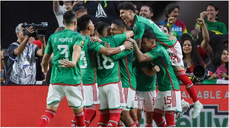 Teammates celebrate with Henry Martin #20 of Mexico