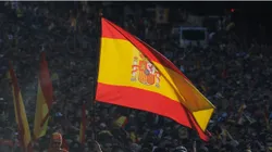 A Spain supporter flies the national flag