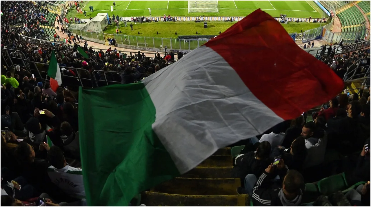 A general view inside the stadium as a fan waves the flag of Italy – Tullio M. Puglia/Getty Images