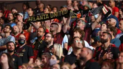 Fans stand prior to the match