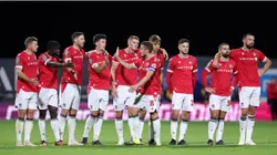 Luke Young of Wrexham celebrates with team mates