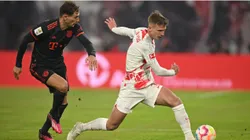 Leon Goretzka of Bayern Muenchen is challenged by Dani Olmo of Leipzig