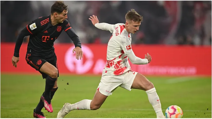 Leon Goretzka of Bayern Muenchen is challenged by Dani Olmo of Leipzig