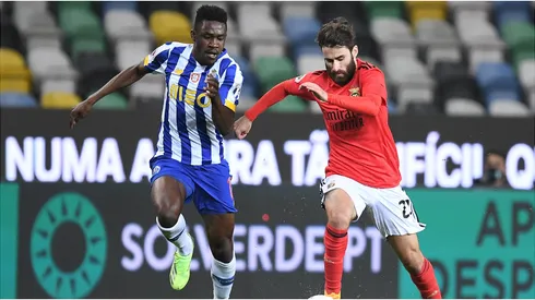 Zaidu Sanusi of FC Porto battles for possession with Rafa Silva of SL Benfica