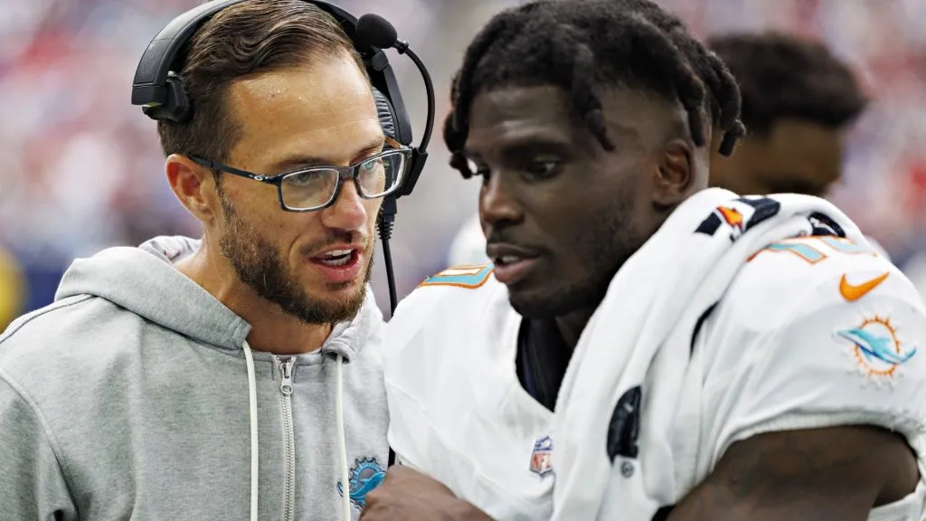 HOUSTON, TEXAS – AUGUST 19: Head Coach Mike McDaniel talks on the sidelines with Tyreek Hill #10 of the Miami Dolphins during the preseason game against the Houston Texans at NRG Stadium on August 19, 2023 in Houston, Texas. (Photo by Wesley Hitt/Getty Images)
