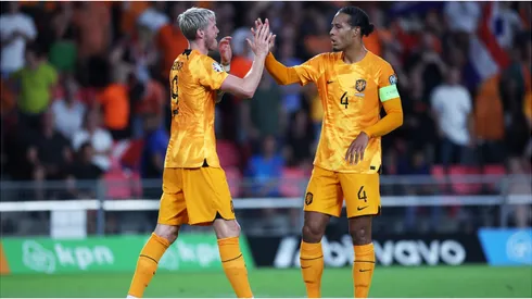 Wout Weghorst of Netherlands celebrates with teammate Virgil van Dijk
